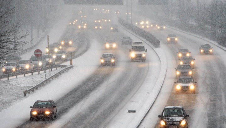 Cars drive on snow covered highways near Brussels